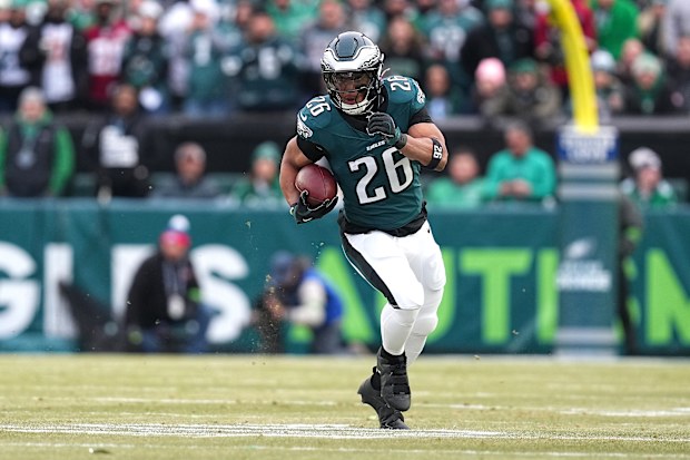 Saquon Barkley #26 of the Philadelphia Eagles runs the ball to score a 60 yard touchdown against the Washington Commanders during the first quarter in the NFC Championship Game at Lincoln Financial Field on January 26, 2025 in Philadelphia, Pennsylvania.  (Photo by Mitchell Leff/Getty Images)