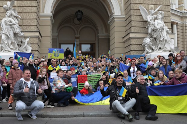 Ukrainians gather in downtown to celebrate the recapturing of Kherson city, Ukraine, Odesa, Saturday, Nov. 12, 2022. 