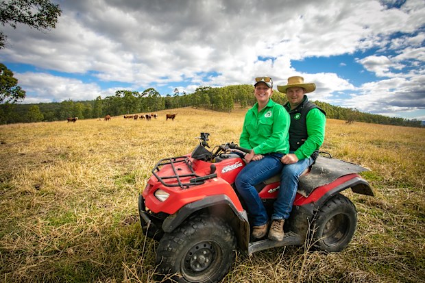 Bianca and Dave farm on vehicle on farm