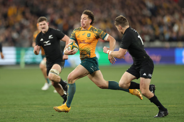 Mark Nawaqanitawase of the Wallabies runs with the ball.