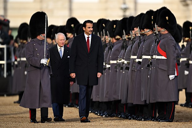 King Charles III (2nd L) with Amir of Qatar Sheikh Tamim bin Hamad Al Thani (C)