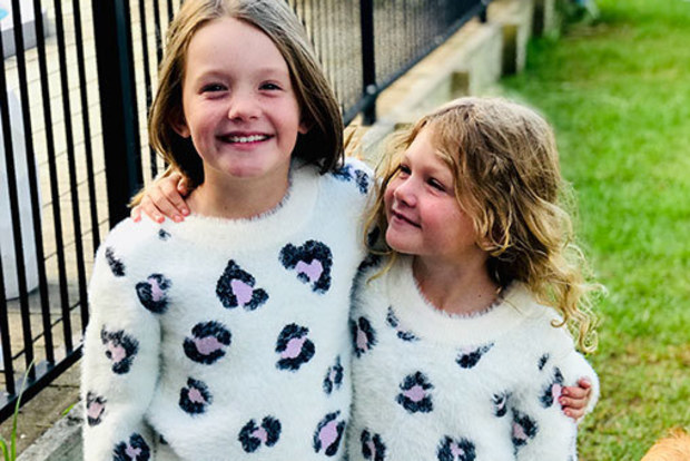 Charli Gerrey with her little sister after cancer treatment.