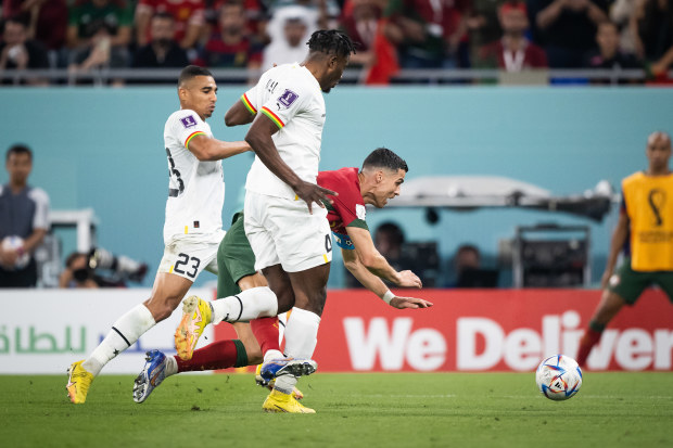  Alexander Djiku (L) of Ghana fouls Cristiano Ronaldo (R) of Portugal followed by a penalty during the FIFA World Cup Qatar 2022 Group H match between Portugal and Ghana at Stadium 974 on November 24, 2022 in Doha, Qatar. (Photo by Marvin Ibo Guengoer - GES Sportfoto/Getty Images)