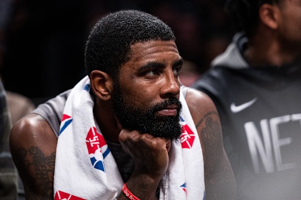 NEW YORK, NEW YORK - NOVEMBER 01: Kyrie Irving #11 of the Brooklyn Nets looks on from the bench during the second quarter of the game against the Chicago Bulls at Barclays Center on November 01, 2022 in New York City. NOTE TO USER: User expressly acknowledges and agrees that, by downloading and or using this photograph, User is consenting to the terms and conditions of the Getty Images License Agreement. (Photo by Dustin Satloff/Getty Images)