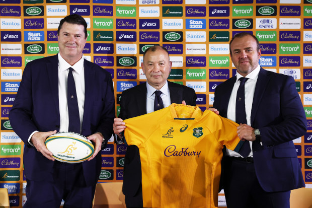 Wallabies coach Eddie Jones (middle) poses alongside Rugby Australia Chairman Hamish McLennan (left) and former Rugby Australia CEO Andy Marinos (right) during a press conference at Matraville Sports High School.