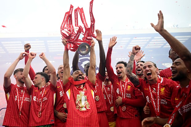 Liverpool celebrates winning the 2024-25 Premier League trophy.