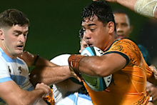 Tevita Alatini of Australia is tackled during the under-20 Rugby Championship.
