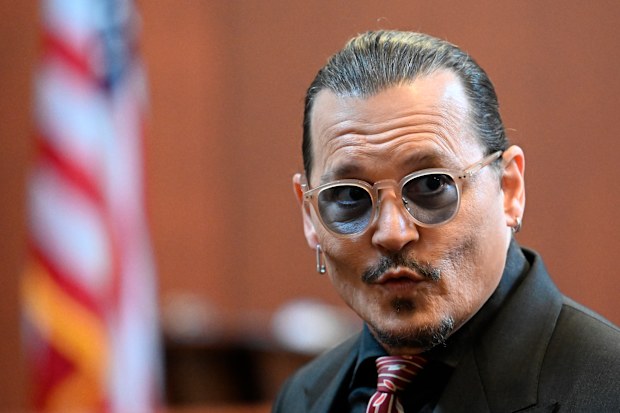 Actor Johnny Depp arrives in the courtroom at the Fairfax County Circuit Court in Fairfax, Va., Tuesday May 3, 2022. 
