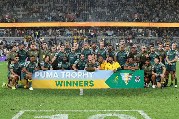 The Wallabies pose with the Puma Trophy.