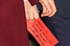 Prince Louis of Wales holds a hand written note addressed to his grandparents as he attends the 'Together At Christmas' Carol Service at Westminster Abbey on December 6, 2024 in London, England. 