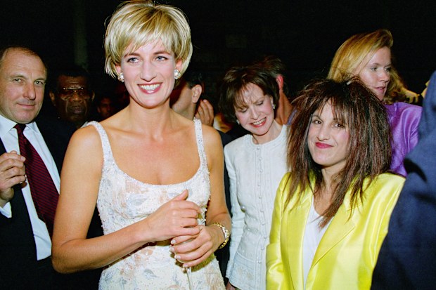 UNITED STATES - JUNE 23:  Diana, Princess of Wales with designer Elizabeth Emanuel at the pre-auction party at Christie's, New York, Her dress is by designer Catherine Walker, Diana's bodyguard, Dave Sharp, is on the left  (Photo by Tim Graham Photo Library via Getty Images) June 1997