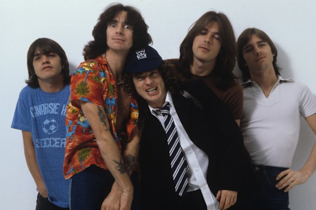 LONDON, UNITED KINGDOM - AUGUST 01: (left to right) Malcolm Young, Bon Scott, Angus Young, Cliff Williams and Phil Rudd of Australian rock band AC/DC pose in London, England in August 1979. (Photo by Fin Costello/Redferns)