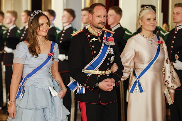 From left, Norway's Princess Ingrid Alexandra, left, Crown Prince Haakon and Crown Princess Mette-Marit on their way to a gala dinner at the Palace in connection with the state visit of the Icelandic presidential couple, in Oslo, Tuesday, April 8, 2025. (Fredrik Varfjell/NTB via AP)