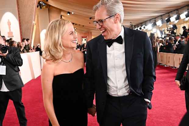 Amy Poehler, Joel Lovell at the 97th Oscars held at the Dolby Theatre on March 02, 2025 in Hollywood, California. 