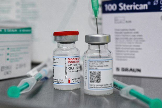 Small bottles containing Moderna's active ingredient for a Corona vaccination are pictured at the vaccination centre in Eberswalde, Germany, Wednesday, Jan. 27, 2021. (Patrick Pleul/dpa via AP)