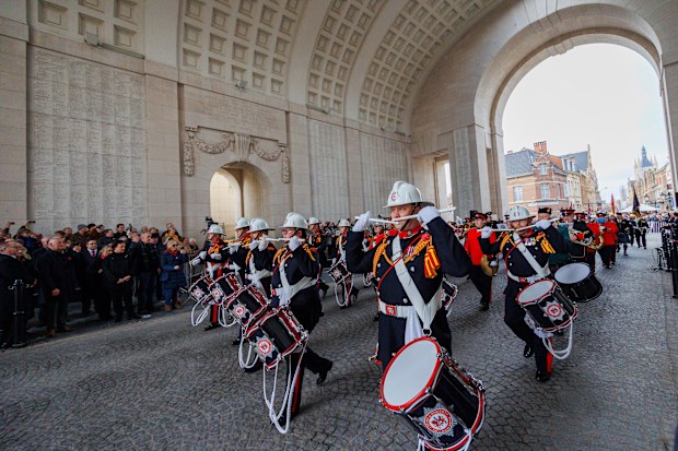 A drums and pipes band marches during an Armistice Day ceremony at the Menin Gate Memorial to the Missing in Ypres, Belgium, Friday, November 11, 2022.