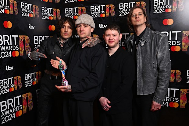 LONDON, ENGLAND - MARCH 02: (EDITORIAL USE ONLY. NO PUBLICATIONS DEVOTED EXCLUSIVELY TO THE ARTIST)  (L-R) Oliver Sykes, Matt Nicholls, Lee Malia, and Matt Kean of "Bring Me The Horizon" pose with their Best Alternative/Rock Act award in the winners room at the BRIT Awards 2024 at The O2 Arena on March 02, 2024 in London, England. (Photo by Kate Green/Getty Images)