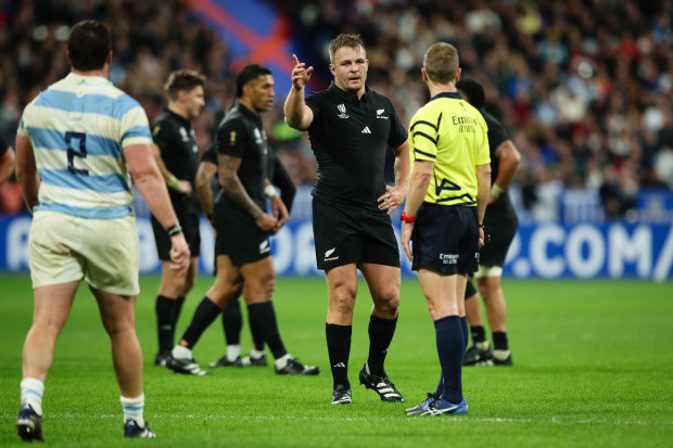 Sam Cane of New Zealand signals a kick at goal at Stade de France.