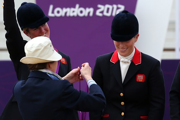 Princess Anne presents her daughter Zara Tinall with a medal at the London 2012 Olympic Games.