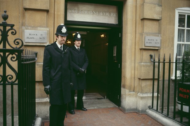 Two policemen outside Lady Diana Spencer's London flat on Coleherne Court, UK, November 1980. 