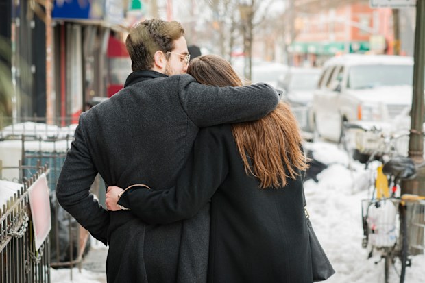 Man and woman walking down street