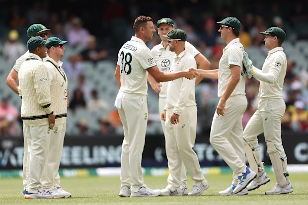 ADELAIDE, AUSTRALIA - JANUARY 17: Josh Hazlewood and Pat Cummins Australia celebrates the wicket of Alick Athanaze of the West Indies during the Mens Test match series between Australia and West Indies at Adelaide Oval on January 17, 2024 in Adelaide, Australia. (Photo by Paul Kane/Getty Images)