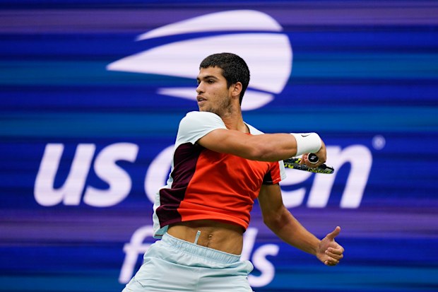 Carlos Alcaraz, of Spain returns a shot to Casper Ruud, of Norway, during the men's singles final of the U.S. Open tennis championships, Sunday, Sept. 11, 2022, in New York. (AP Photo/Charles Krupa)