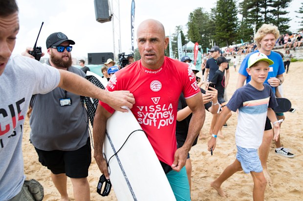 Kelly Slater emerges from the water after competing in the Vissla Sydney Surf Pro at Manly Beach, Sydney in 2019.
