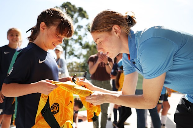 Cortnee Vine of Sydney FC signs autographs for young participants during a Sydney FC Women's Football Legacy Announcement at Sky Park on September 05, 2023 in Sydney, Australia. 