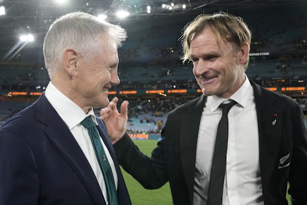 New Zealand coach Scott Robertson chats with Australia coach Joe Schmidt.