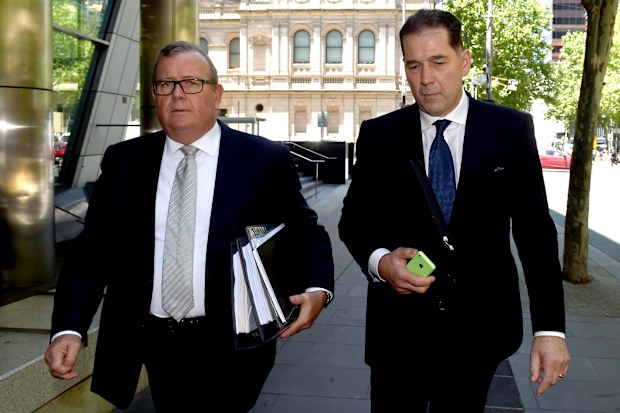 Former chiropractor, Malcolm Hooper leaves the County Court with his lawyer Tony Hargreaves (left) charged with safety breaches after a client died following treatment