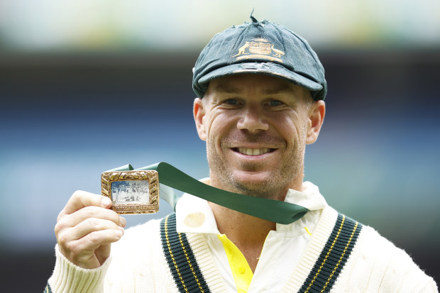 MELBOURNE, AUSTRALIA - DECEMBER 29: David Warner of Australia holds the Mullagh Medal after being awarded player of the match during day four of the Second Test match in the series between Australia and South Africa at Melbourne Cricket Ground on December 29, 2022 in Melbourne, Australia. (Photo by Daniel Pockett/Getty Images)