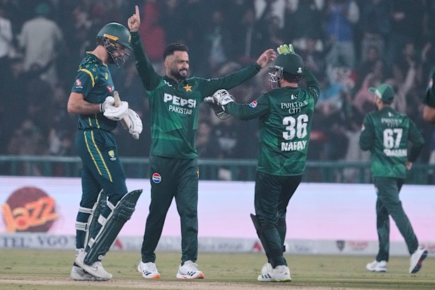 Pakistan's Mohammad Nawaz celebrates with teammates after the dismissal of Australia's Matthew Short.