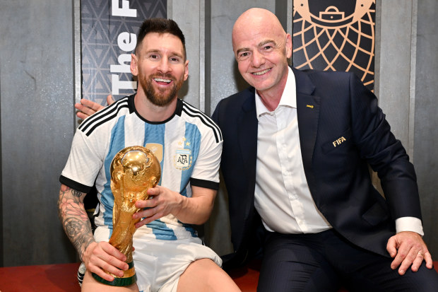 FIFA President Gianni Infantino poses with Lionel Messi in the Argentina dressing room.