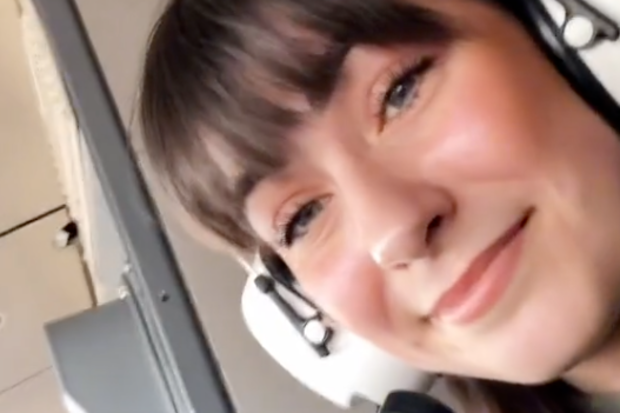 Aurora Torres sitting in the cockpit of the plane.