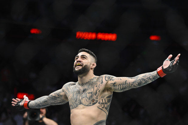 Tyson Pedro of Australia celebrates after defeating Harry Hunsucker of the United States in a light heavyweight bout during UFC 278.