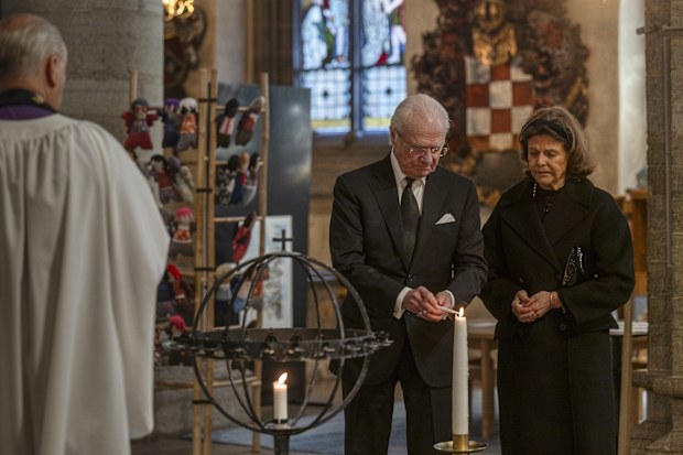 OREBRO, SWEDEN - FEBRUARY 5: King Carl XVI Gustaf and Queen Silvia light candles inside S:t Nicolai Church to honor the victims of the school shooting on February 5, 2025 in Orebro, Sweden. On Tuesday a gunman opened fire in an adult education center at Risbergska School, in the Swedish city of Orebro, about 200 kilometers (124 miles) west of the capital, Stockholm. According to police, the attack left at least 10 people dead. The suspect is believed to be among the dead. (Photo by Jonas Gratzer