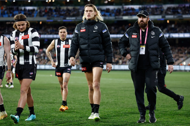 MELBOURNE, AUSTRALIA - AUGUST 11: Darcy Moore of the Magpies is seen after being subbed from the game with a leg injury during the 2023 AFL Round 22 match between the Collingwood Magpies and the Geelong Cats at Melbourne Cricket Ground on August 11, 2023 in Melbourne, Australia. (Photo by Michael Willson/AFL Photos via Getty Images)