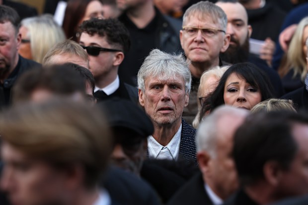 MANCHESTER, ENGLAND - DECEMBER 22:   Bez of the Happy Mondays attends the funeral of Gary Mounfield, also known as Mani, at Manchester Cathedral on December 22, 2025 in Manchester, England. Mani is know for being the bass guitarist in rock bands The Stone Roses and Primal Scream. He died on November 20, 2025 at the age of 63 after suffering from a long-standing lung condition.  (Photo by Ryan Jenkinson/Getty Images)