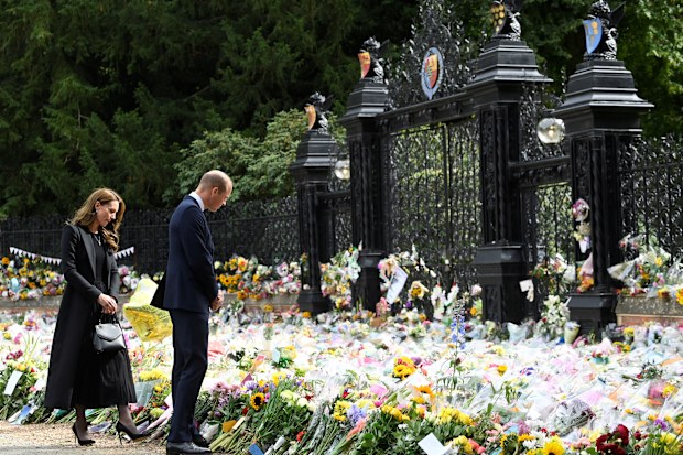 Prince William, Prince of Wales and Catherine, Princess of Wales, view floral tributes placed outside the Sandringham Estate following the death of Queen Elizabeth II, on September 15, 2022 in King's Lynn, England. 