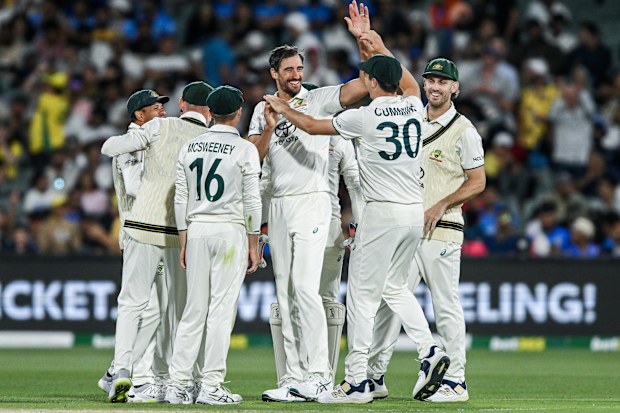 Mitchell Starc of Australia  celebrates the wicket of Shubman Gill of India.
