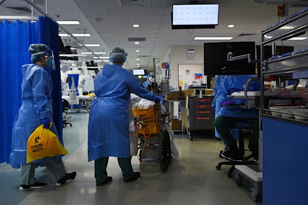 Patients in hospital with coronavirus are younger and sicker with the Delta strain. Pictured: Staff at St Vincent's Hospital ICU.