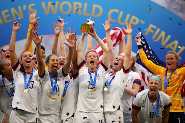 Megan Rapinoe of the USA lifts the trophy as USA celebrate victory during the 2019 FIFA Women's World Cup France Final match between The United State of America and The Netherlands at Stade de Lyon on July 07, 2019 in Lyon, France.