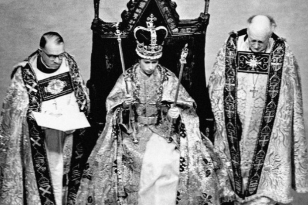 In 1953, the Coronation of Queen Elizabeth II took place at Westminster Abbey. Her Majesty is pictured during the Crowning Ceremony, seated on the Coronation Chair, wearing the St. Edward Crown and carrying the Sovereign's Sceptre and Rod.