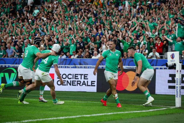 PARIS, FRANCE - OCTOBER 7:  James Lowe of Ireland celebrates scoring his sides first try with team mates during the Rugby World Cup France 2023 match between Ireland and Scotland at Stade de France on October 7, 2023 in Paris, France. (Photo by Craig Mercer/MB Media/Getty Images)