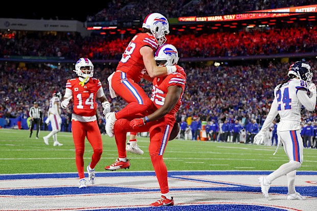 Quintin Morris of Buffalo celebrates with Dawson Knox after catching a touchdown pass.