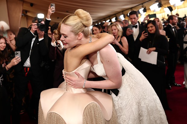 Ariana Grande and Elle Fanning attend the 97th Annual Oscars at Dolby Theatre on March 02, 2025 in Hollywood, California. 