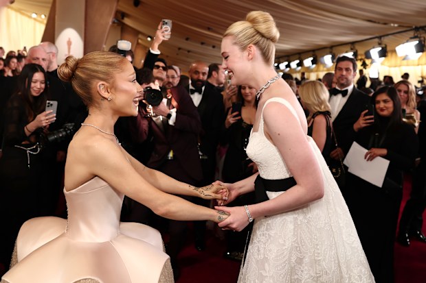 Ariana Grande and Elle Fanning attend the 97th Annual Oscars at Dolby Theatre on March 02, 2025 in Hollywood, California. 