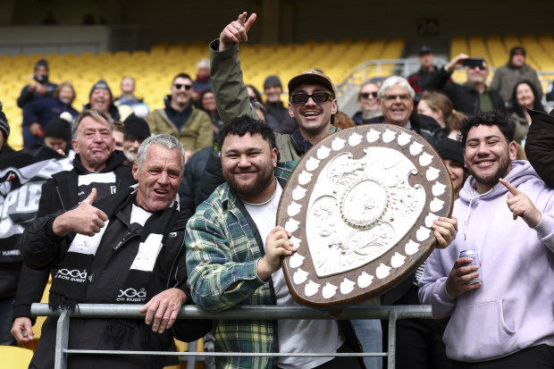 Fans celebrate with the Ranfurly Shield, which had recently undergone a restoration.