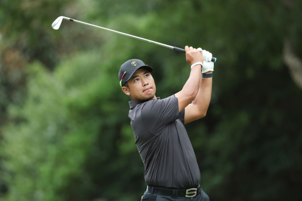 Hideki Matsuyama of Japan and the International Team plays his shot from the sixth tee during Sunday singles matches on day four of the 2022 Presidents Cup at Quail Hollow Country Club on September 25, 2022 in Charlotte, North Carolina. (Photo by Warren Little/Getty Images)